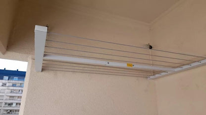 Wall-mounted clothesline, space-saving and weather-resistant.