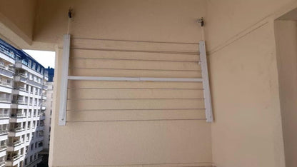 Wall-mounted clothesline, space-saving and weather-resistant.