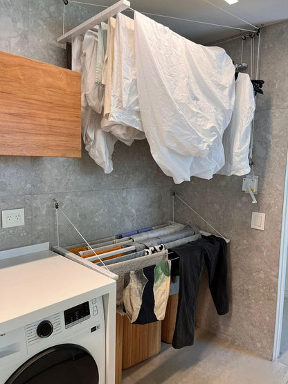 Wall-mounted clothesline, space-saving and weather-resistant.