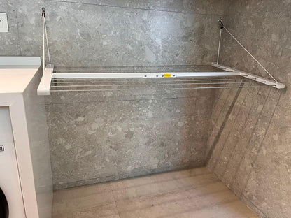 Wall-mounted clothesline, space-saving and weather-resistant.