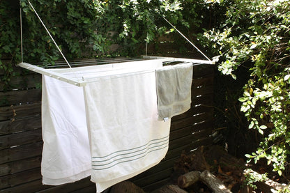 Wall-mounted clothesline, space-saving and weather-resistant.
